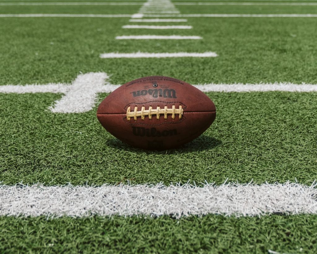 An American football on the field